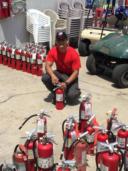 Short Fire Protection inspecting fire extinguishers in Memphis TN.